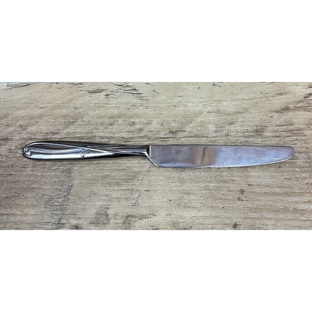 Mikasa Cocoa Blossom Stainless Dinner Knife with surface scratching